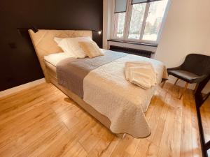 Posteľ alebo postele v izbe v ubytovaní Apartamenty KTW Park Śląski