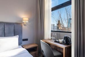 Postel nebo postele na pokoji v ubytování Barnovi Boutique Hotel