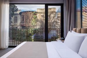 Postel nebo postele na pokoji v ubytování Barnovi Boutique Hotel + 34 fotografií
