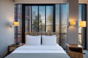 Postel nebo postele na pokoji v ubytování Barnovi Boutique Hotel
