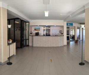 an empty lobby with a counter in a building at Hotel Villa Costa in Celle Ligure