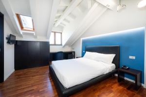 Postel nebo postele na pokoji v ubytování SIRIOHotel