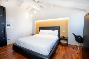Postel nebo postele na pokoji v ubytování SIRIOHotel