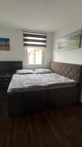 Postel nebo postele na pokoji v ubytování Apartman Centrum 403