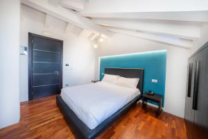 Postel nebo postele na pokoji v ubytování SIRIOHotel