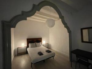 Katil atau katil-katil dalam bilik di Cal Mestre- Olot