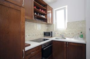 Kuchyň nebo kuchyňský kout v ubytování Apartments Spas + 37 fotografií