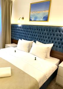 Postel nebo postele na pokoji v ubytování Luxury Rooms Skadarlija