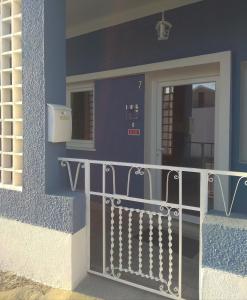 a front door of a house with a fence at Casa Fisher in Vendas Novas