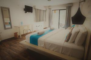 Postel nebo postele na pokoji v ubytování Hotel Luna De Plata