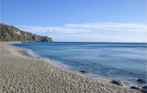 a view of a sandy beach with the ocean at Casa 56 F in Pizzo