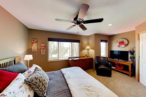 a bedroom with a bed and a ceiling fan at Eagle Crest in Redmond