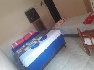 מיטה או מיטות בחדר ב-Pousada Refúgio da Chapada
