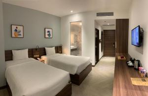 Postel nebo postele na pokoji v ubytování CHAU KHUONG HOTEL