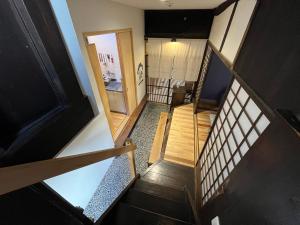 Uma televisão e/ou sistema de entretenimento em Only one group stays per day -Tenmaya-家族や仲間と貸し切りゲストハウス 天満屋