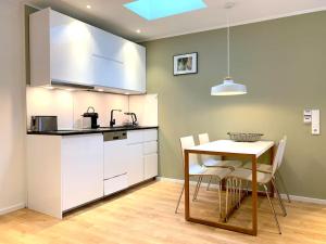 Dapur atau dapur kecil di Apartment - Neu, modern, gemütlich, eigener Parkplatz