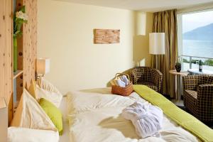 Ένα ή περισσότερα κρεβάτια σε δωμάτιο στο Hotel Alexander
