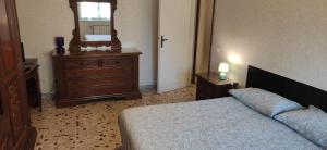 Postel nebo postele na pokoji v ubytování Sweet home in Ostia