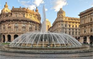 a water fountain in front of a building at Gorgeous Apartment In Genova in Genova