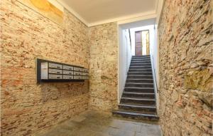 a staircase in a room with a brick wall at Gorgeous Apartment In Genova in Genova