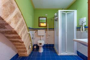 a bathroom with a sink and a toilet and a shower at Stenopus Greco Casa per AFFITTI TURISTICI in Santa Flavia