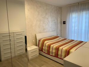 A bed or beds in a room at Trilocale in Zona Bocconi/Navigli