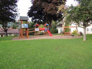 a playground with two play equipment in a park at Familienglück in der Weststeiermark in Sankt Oswald ob Eibiswald