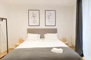 Postel nebo postele na pokoji v ubytování New Guggenheim