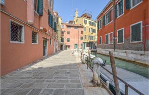 a canal in a city with buildings and a fire hydrant at Beautiful apartment in Venezia with WiFi in Venice