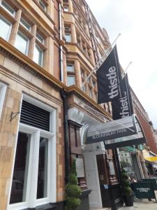 a building with a sign in front of it at Thistle London Bloomsbury Park in London