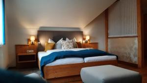 Postel nebo postele na pokoji v ubytování Hotel Garni Landhaus Florian