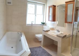 A bathroom at Appartement Waldfriede Még 35 kép