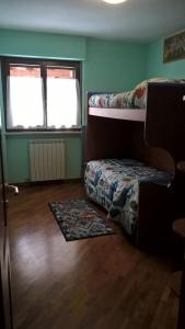 Ένα ή περισσότερα κρεβάτια σε δωμάτιο στο La casa dei Dalmass