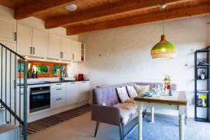 A kitchen or kitchenette at Ferienhaus mit privaten Schwimmteich und Sauna
