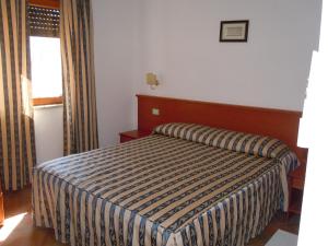 A bed or beds in a room at Il Castello Még 37 kép