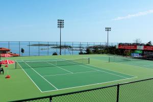 a tennis court with two tennis nets on it at Lilia Sun Apartment in Sozopol