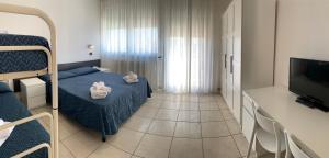TV a/nebo společenská místnost v ubytování Hotel Marylise