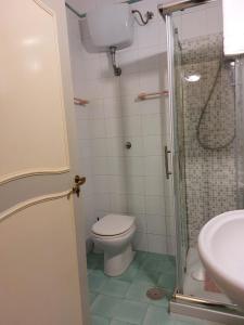 a bathroom with a toilet and a shower and a sink at Residenza Sorrentina in Sorrento