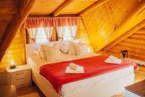 a bedroom with a bed in a log cabin at Holiday Home Vinola in Sveti Martin na Muri