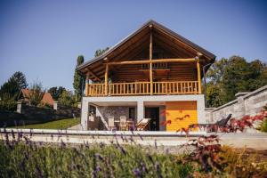 a large house with a wooden roof at Holiday Home Vinola in Sveti Martin na Muri