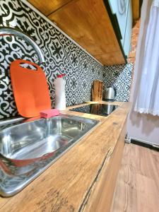 a kitchen counter with a sink in a kitchen at HiDEAWAY #Menorah #MostCity in Dnipro +68 photos