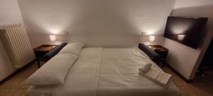 A bed or beds in a room at FGH Mono Locale ZONA FIERA