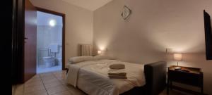 A bed or beds in a room at FGH Mono Locale ZONA FIERA