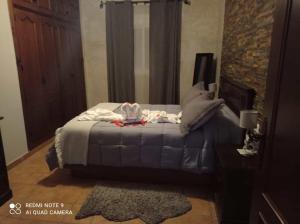 Una cama o camas en una habitación de FINCA LOS CHATOS