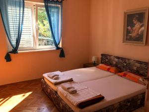 Postel nebo postele na pokoji v ubytování Apartment Pero
