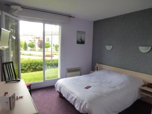 Postel nebo postele na pokoji v ubytování Hotel Agena Hagondange