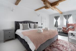 מיטה או מיטות בחדר ב-Hygge Loft Bucovina