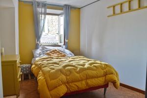 Postel nebo postele na pokoji v ubytování La Joannassiène, maison Ardéchoise de caractère