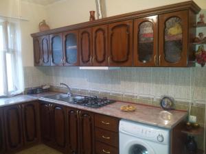 a kitchen with a sink and a washing machine at Gayane & Khikar B&B in Chʼiva