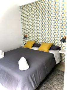 Katil atau katil-katil dalam bilik di Apartamentos Cruz Granada